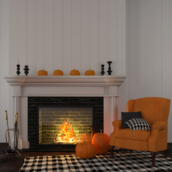 Vintage orange armchair near the fireplace