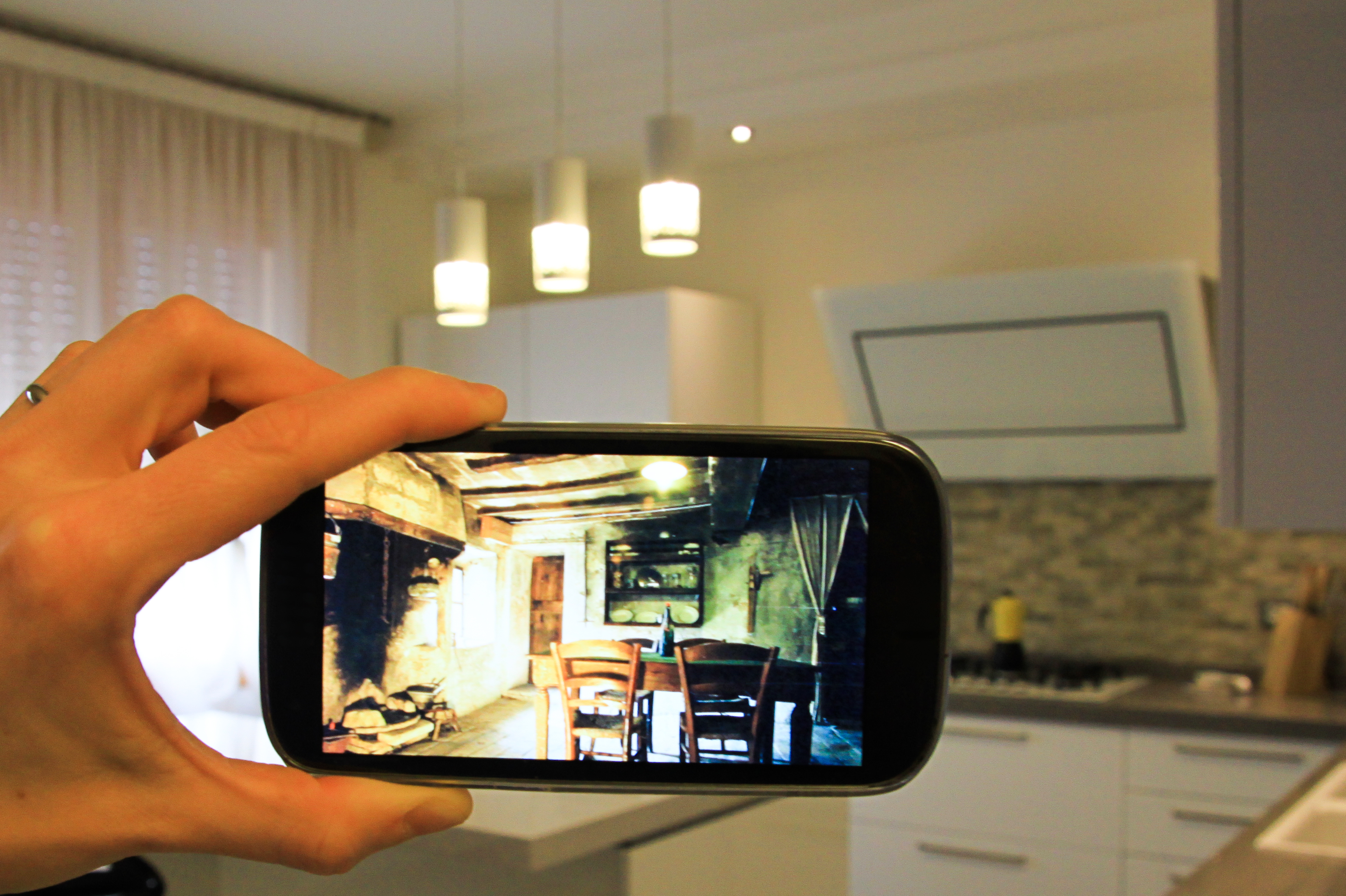 an idea with an smartphone and a modern kitchen