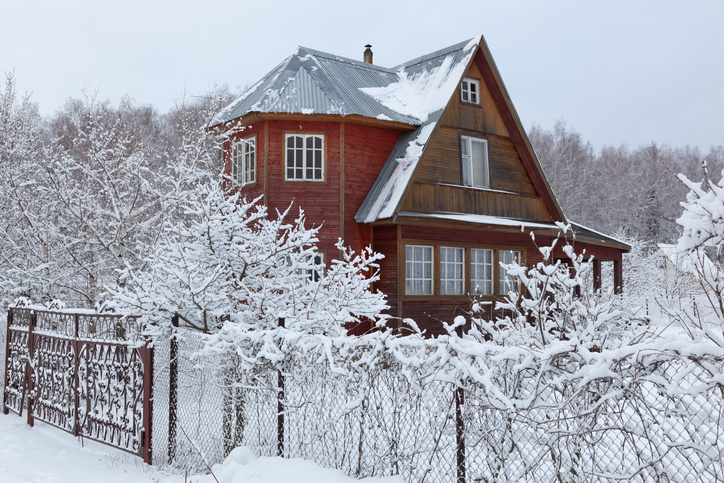 House in countryside after heavy snowfall. Moscow region. Russia.